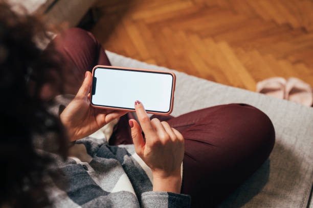 person using smartphone for budgeting