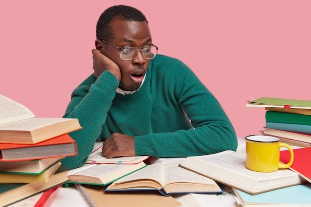 person reading, focused, glasses