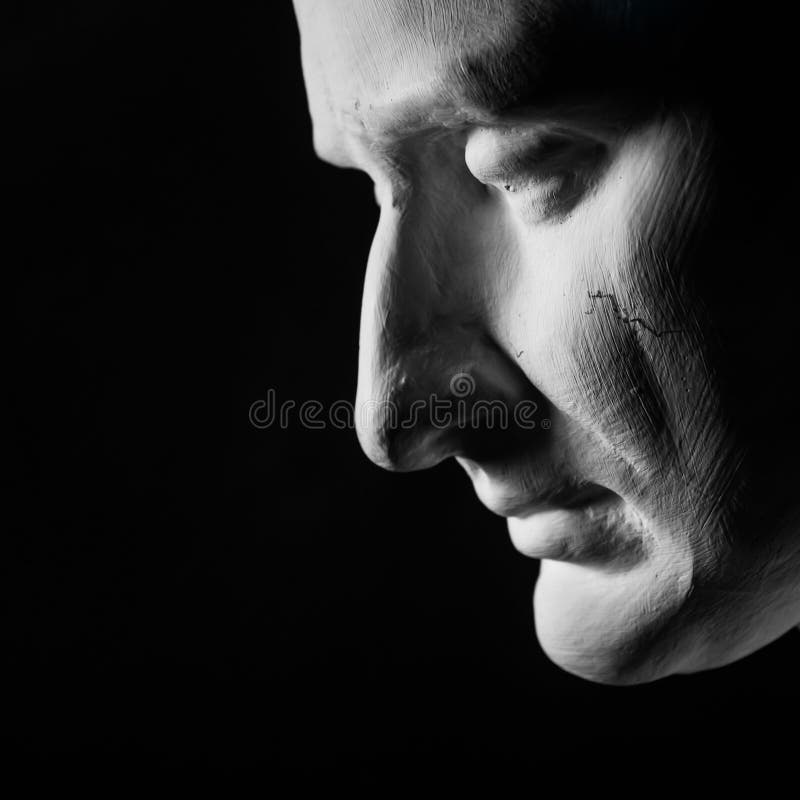 person looking down, sad, defeated