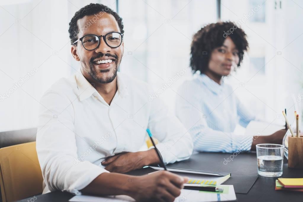 two people talking, blurred background, modern office