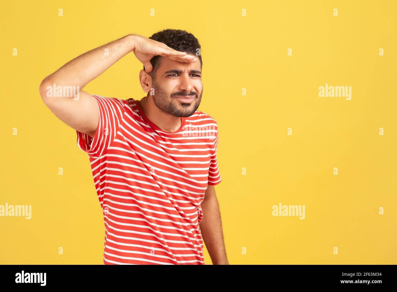 person nodding, attentive expression, blurred background
