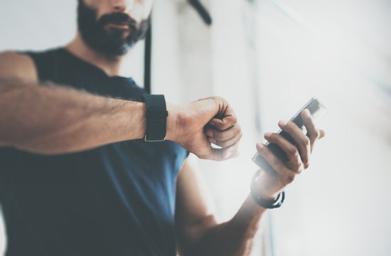 man wearing fitness tracker during workout
