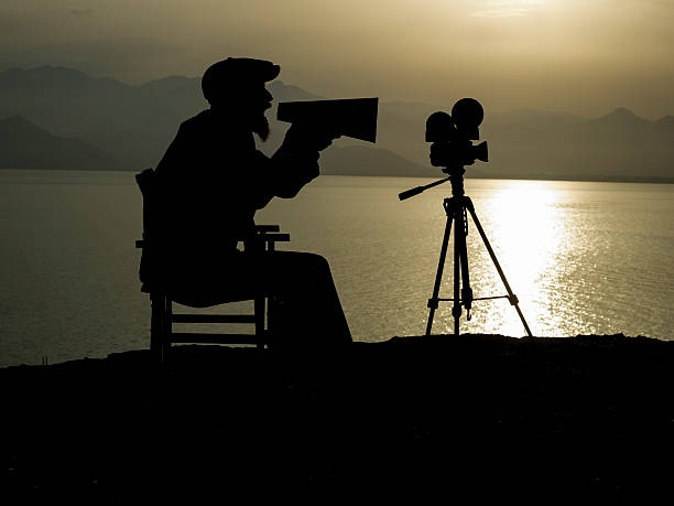 film camera, director, movie set, sunset