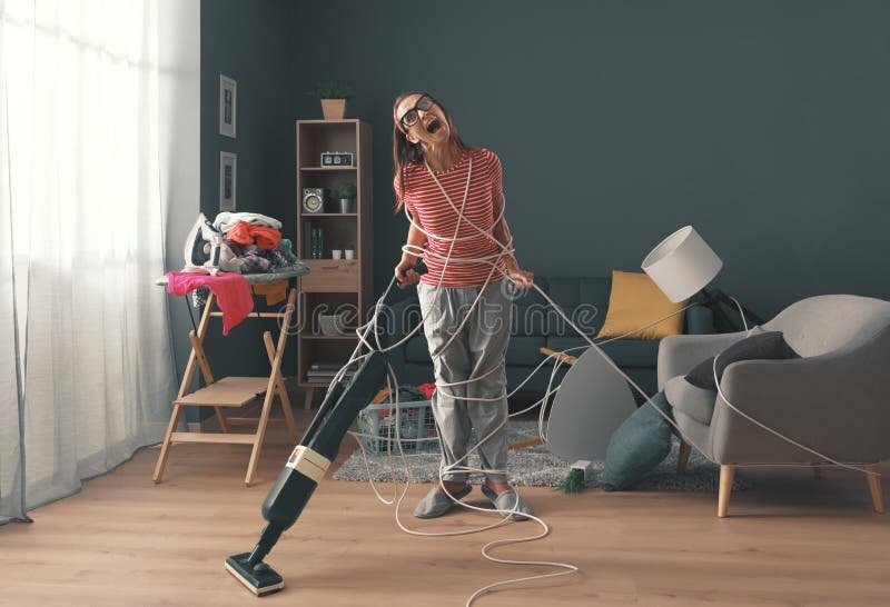woman looking stressed while vacuuming