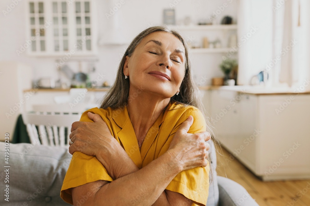 person hugging themselves, comfort