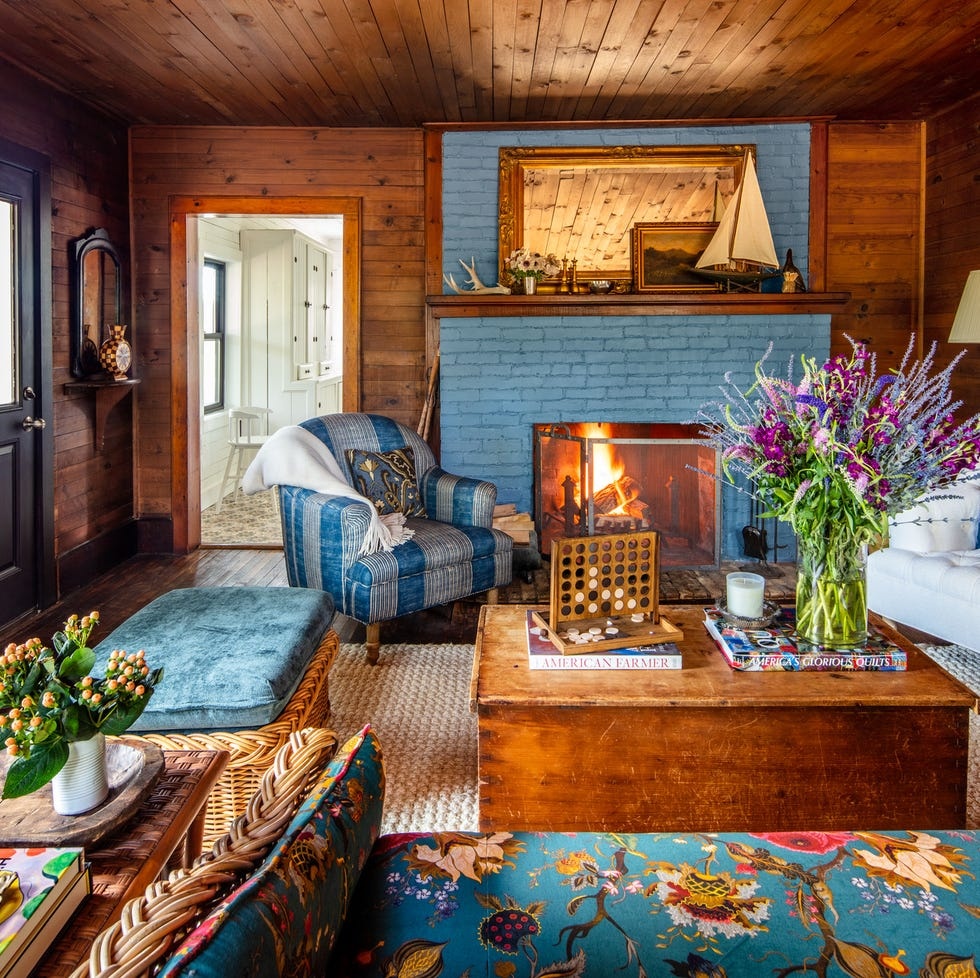 cozy living room, fireplace, soft lighting, books