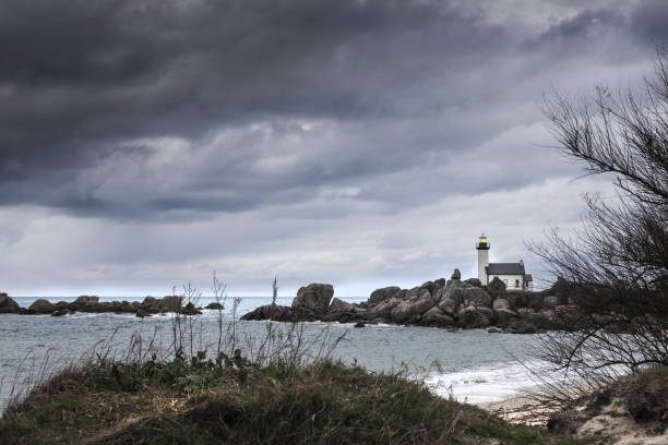 lighthouse,german coastline,overcast sky,abandoned building