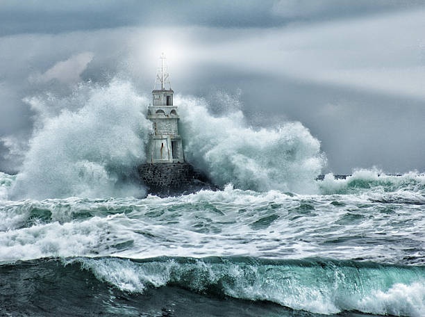 lighthouse,canadian coastline,stormy sea,weathered structure