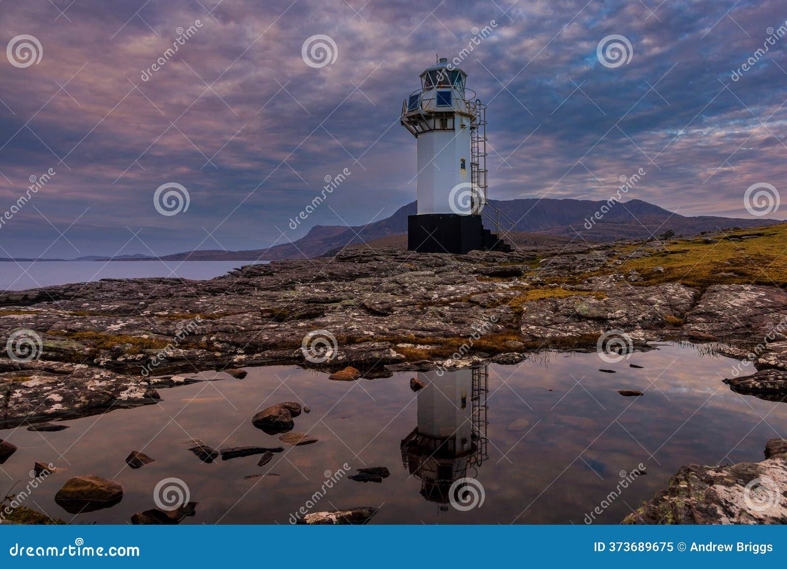 lighthouse,scottish island,dark clouds,stone tower