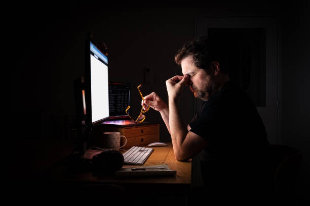 stressed freelancer, computer, dark room