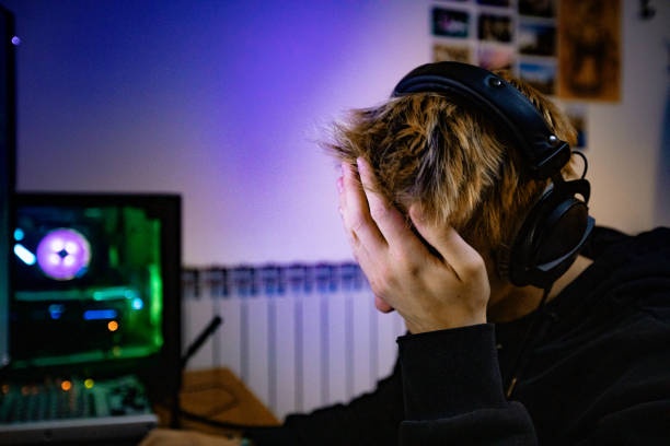 Broken game console, frustrated gamer