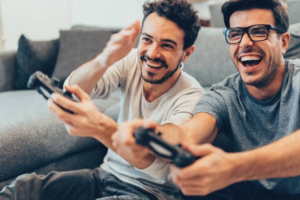 Happy gamer playing game with friends