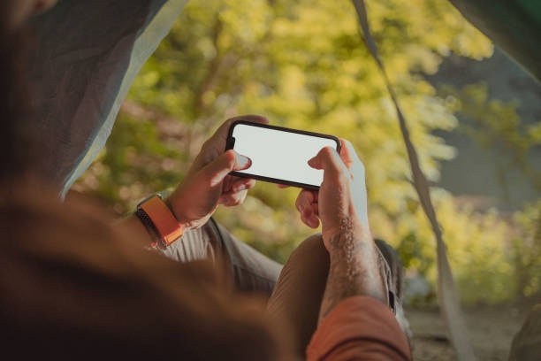 person using smartphone while traveling