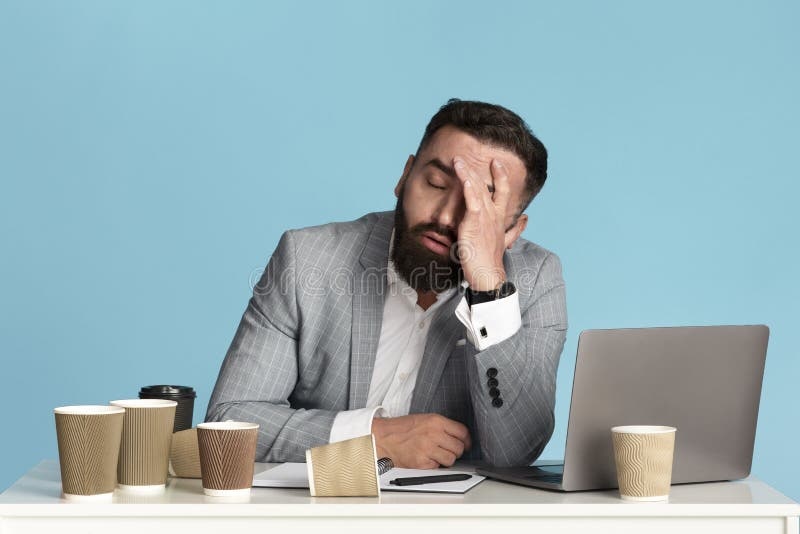person looking stressed, laptop, coffee cup