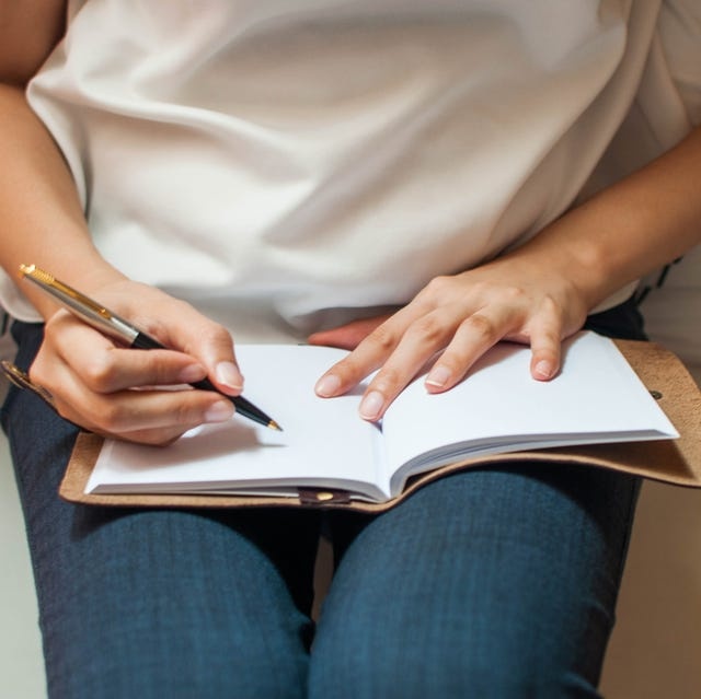 person writing in journal, positive affirmations, sunlight, hope