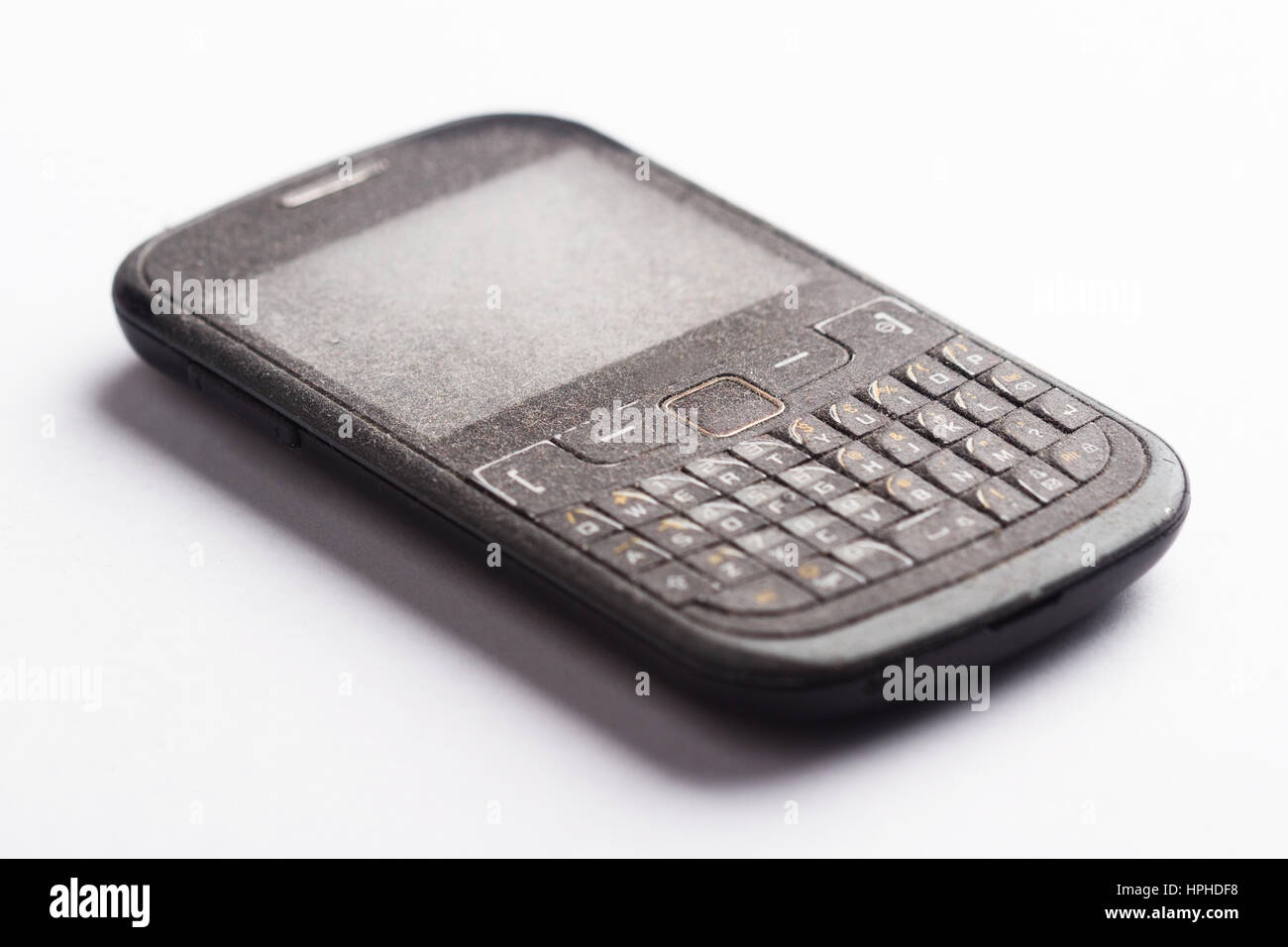 old smartphone, dusty, close-up