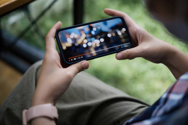 smartphone acting as media server, displaying movie cover art