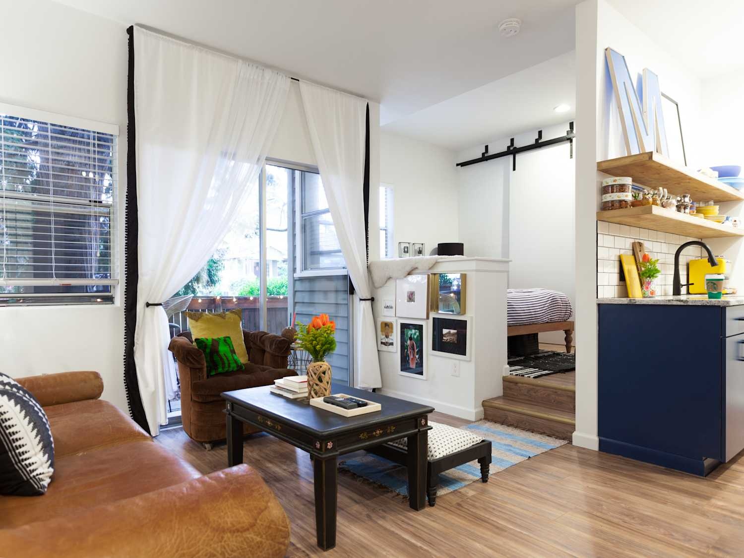 small apartment with textile divider, cozy corner