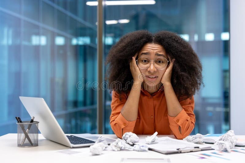 stressed person at desk, overwhelmed, deadline