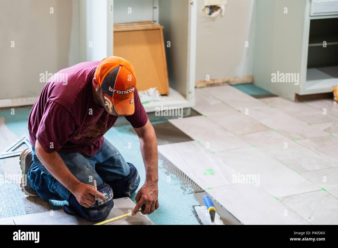 man,woman,checking,tiles,measuring,quality