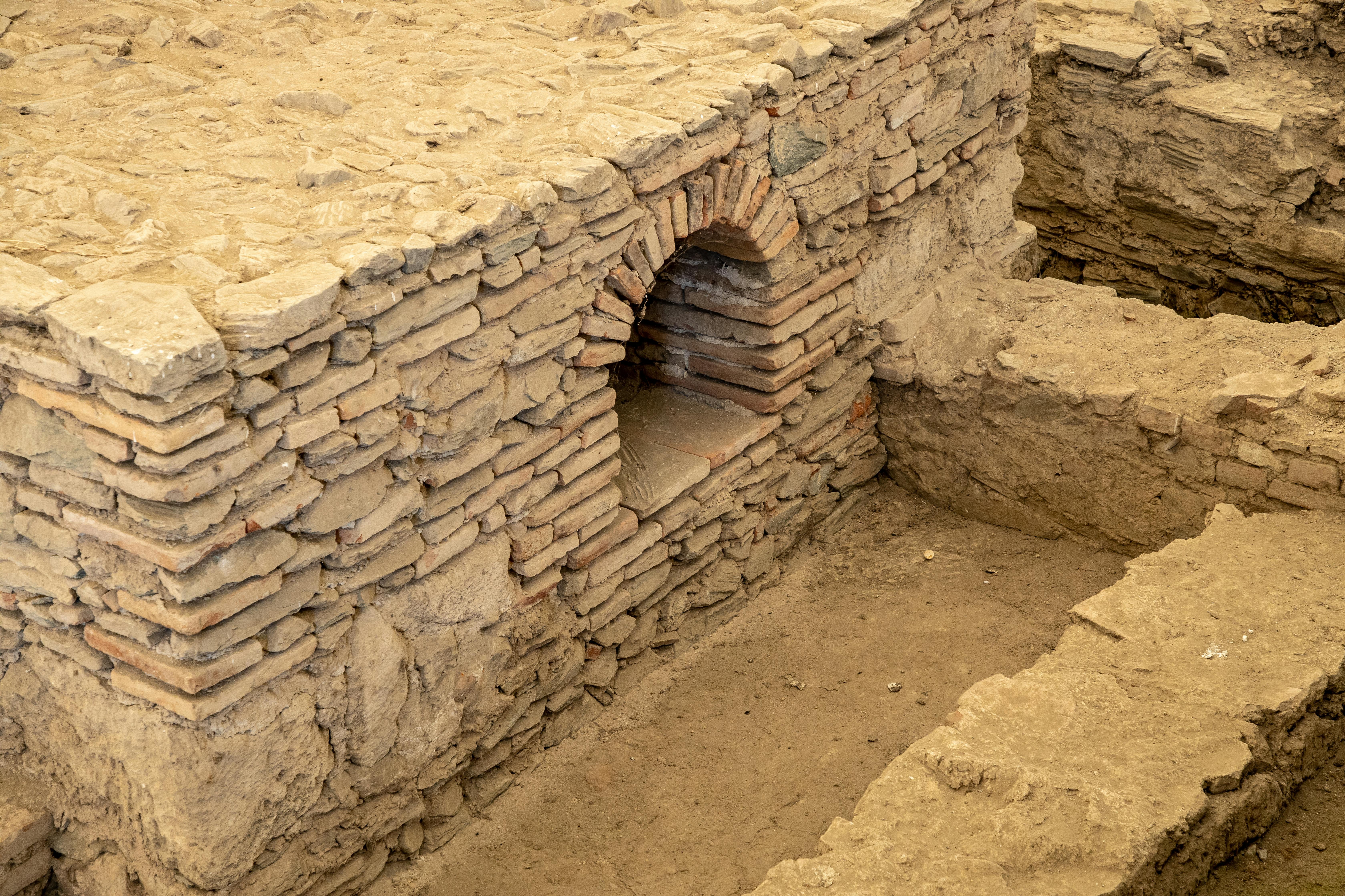 ancient ruins, stone blocks, excavation site, archaeologists