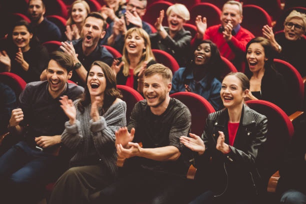 crowded movie theater, excited audience