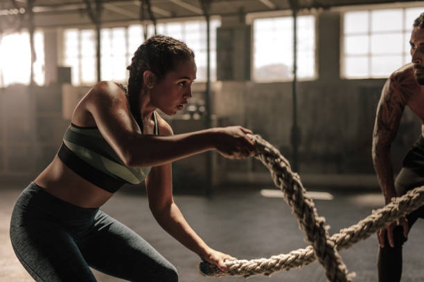 person doing HIIT workout, intense expression