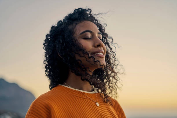 person meditating, peaceful expression