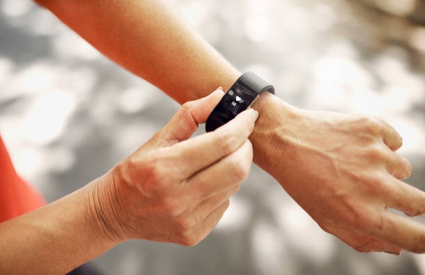 close up of fitness tracker on wrist, showing step count