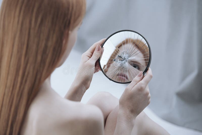 person looking in mirror, distorted reflection
