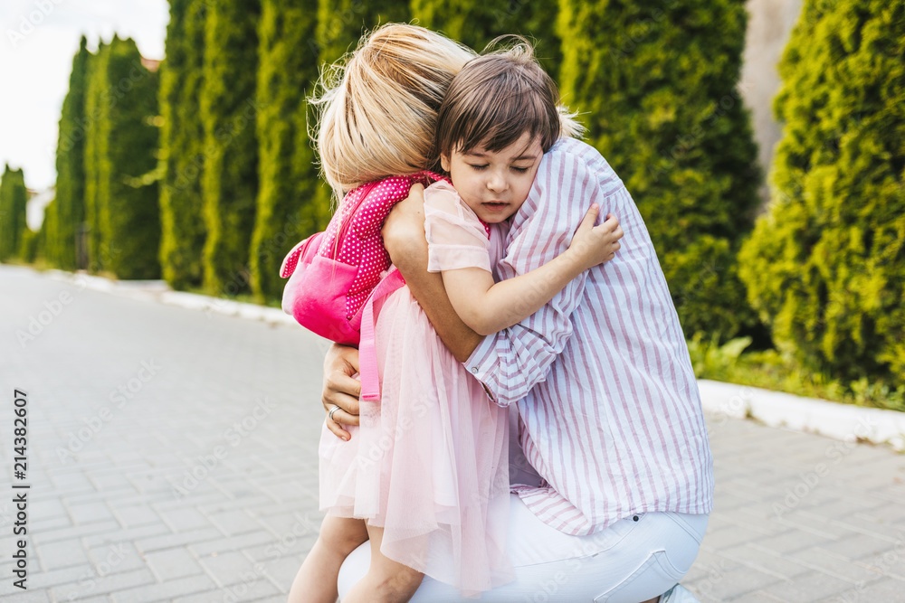 child hugging parent, showing affection