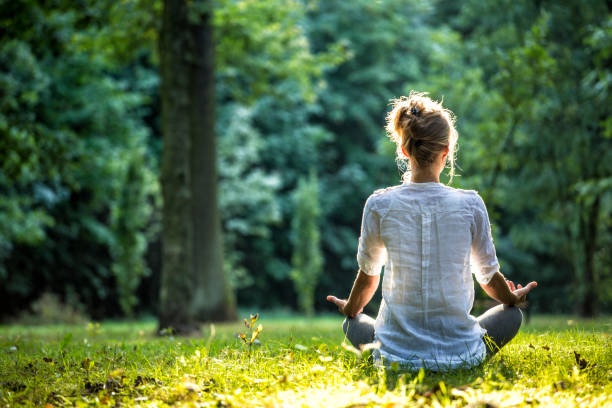 person meditating, calm, peaceful, nature