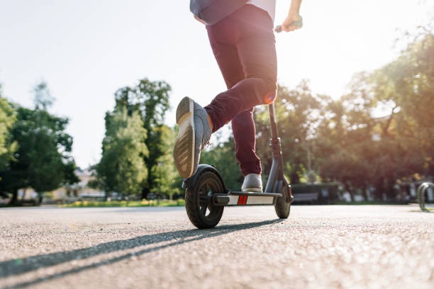electric scooter,city,park,sun