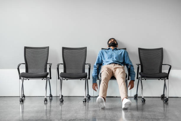 person sitting slumped, looking discouraged