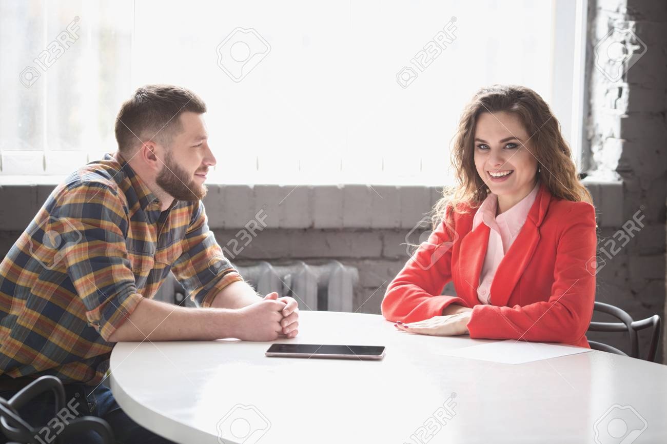 man and woman talking, business meeting