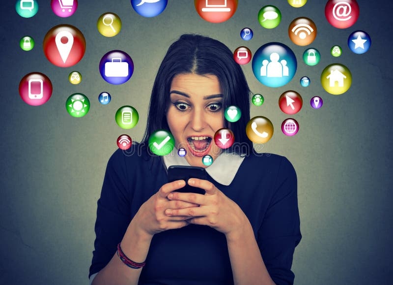 person staring at phone, overwhelmed, blurred background
