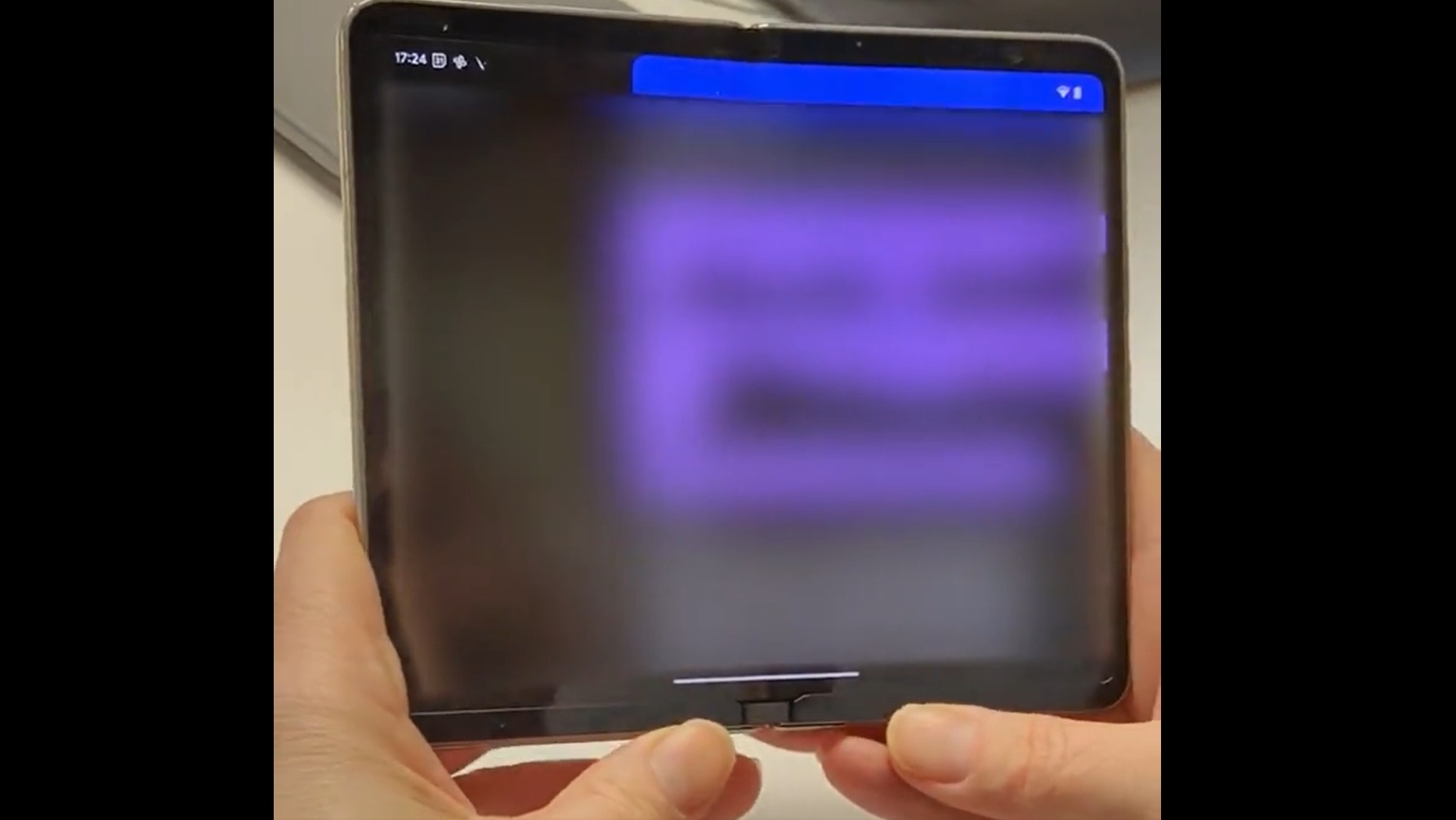 folded smartphone, close-up, focus on hinge