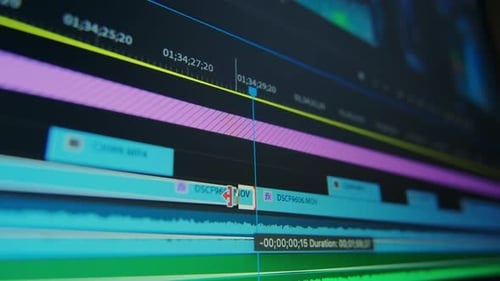 laptop screen, video editing software, timeline