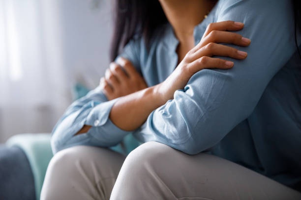 person hugging themselves, comforting gesture