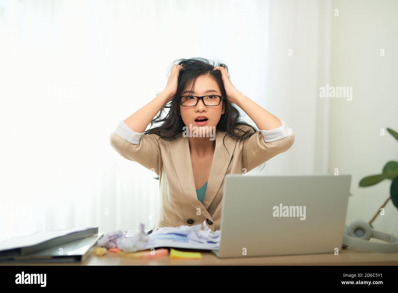 person working at laptop, stressed