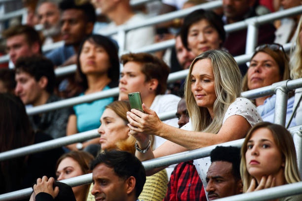 crowd of people looking at phone screens