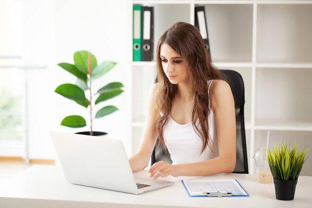person working on laptop, home office, bright, modern