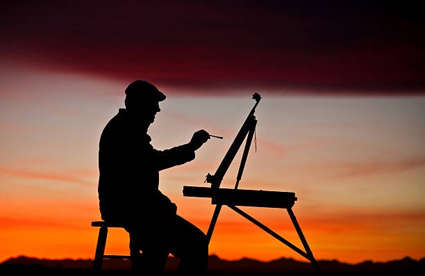 person painting, relaxed, sunlight