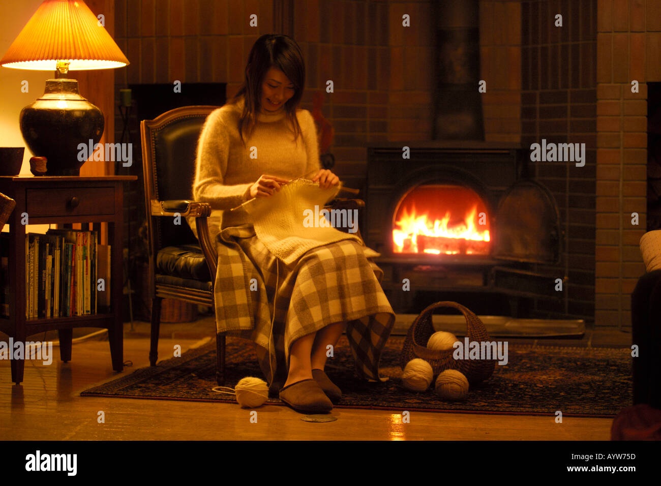 woman knitting, cozy, fireplace