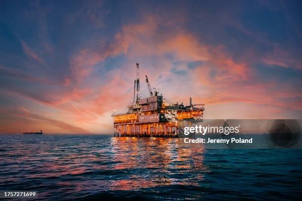 oil rig,ocean,sunset