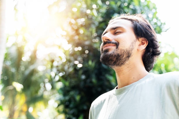 person meditating,peaceful face,nature background