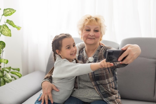 grandmother, smiling, video call, granddaughter