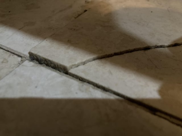 damaged tile floor, cracked, uneven, tiles falling off