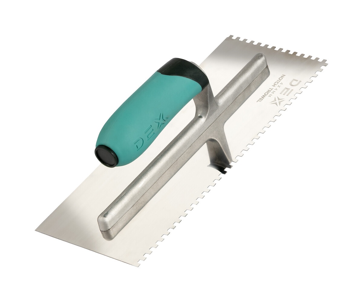 mixing tile adhesive, bucket, trowel, close-up