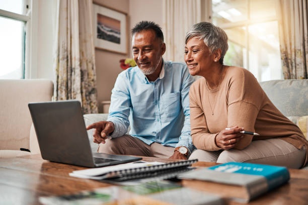 couple looking at money, financial planning